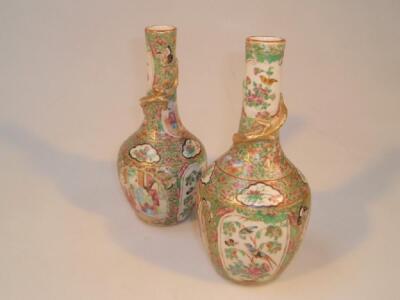 A pair of 19thC Canton enamel famille rose bottle vases