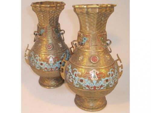 A pair of late 19thC Chinese gilt metal baluster vases with flared hexagonal necks