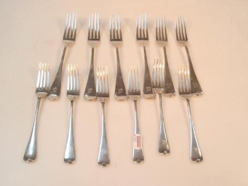 A matched set of Victorian and later Old English pattern silver table and dessert forks