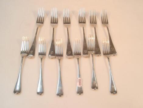 A matched set of Victorian and later Old English pattern silver table and dessert forks