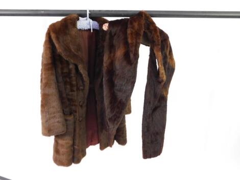 A mink jacket, together with a mink stole.