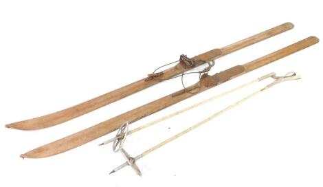 A pair of Resko early 20thC Elite skis, together with a pair of Touring ski poles. (4)