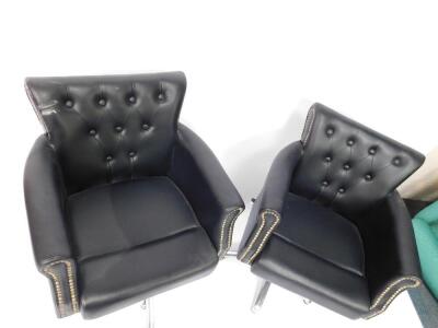 Two black leather barber's chairs, each with button back, raised on a metal frame and five point star base, with footrest and adjustable seat lever. - 3