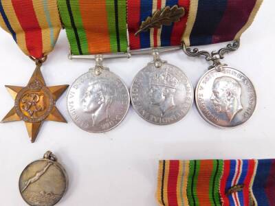 A WWII and pre war group of medals, awarded to Wing Commodore A T Atkins, comprising Africa Star, Defence Medal, 1939-45 War Medal with oak leaf, mentioned in dispatches June 1944 in relation to D-Day, and a GV RAF Long Service and Good Conduct Medal, tog - 3