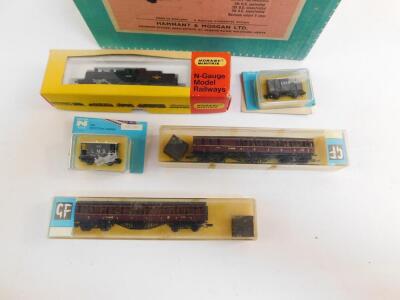 A Hornby Minitrix N gauge locomotive, British Rail black livery, 2-6-0, 46400N202, two GF LMS coaches and two Peco LMS goods wagons, all boxed, together with an Hammant & Morgan Ltd Duet dual control unit, all boxed. (6) - 2