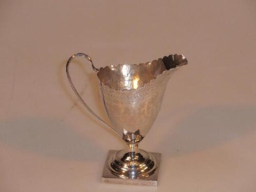 A George III silver helmet cream jug by George Smith & Thomas Hayter