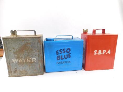 An ESSO blue paraffin can, painted blue with dark blue lettering, 24.5cm H, a red painted petrol can with white lettering S.B.P.4, and a military water can. (3)