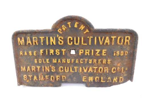 A Martin's Cultivator RASE First Prize 1900 cast iron plate, for Martin's Cultivator Company, Stamford England, painted black with yellow lettering, 22cm H, 37cm W.