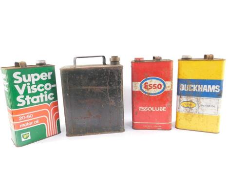 Three vintage oil cans, comprising BP, Esso, Duckhams, together with a Shell petrol can. (4)