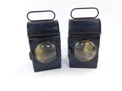 A pair of black painted railway lamps with Sherwood Patent burners, 18.5cm H.