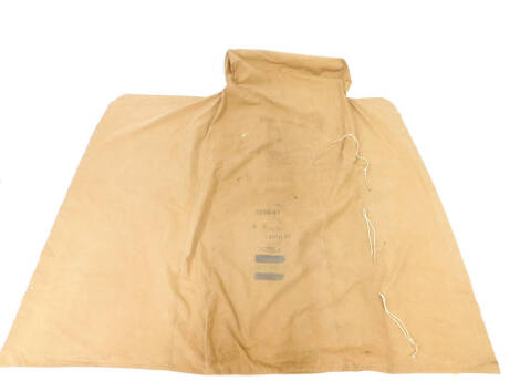 A WWII canvas motorcycle cover, stamped McNamara Motors Limited, dated 1943.