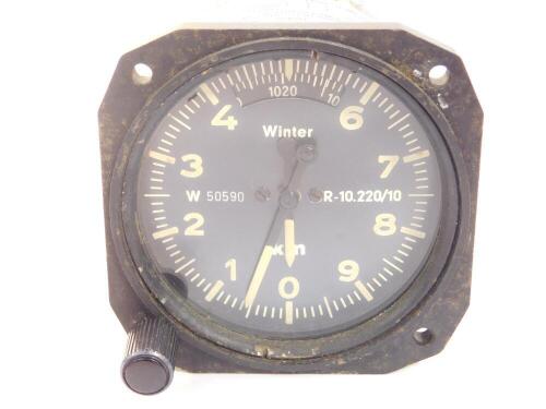 A Winter Instruments aircraft altometer, model no 4 FGH 10, black dial with white loomed numbers, jewel pointers, 18mm Dia, measuring range to 10,000mtrs, 0.41kg, manufactured 14/9/1967.