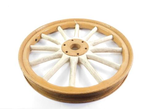 A Model T Ford wheel, painted brown with white spokes, 61cm Dia.