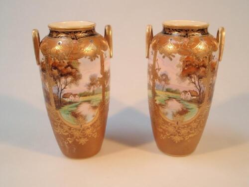 A pair of Noritake two-handled ovoid vases painted with encircling landscape