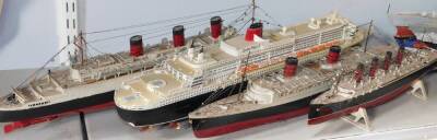 Four scale models of passenger liners, comprising RMS Queen Mary, 51cm L., Cunard Queen Mary II, 59cm L, Queen Elizabeth, 52cm L, and Mauritania, 40cm L.