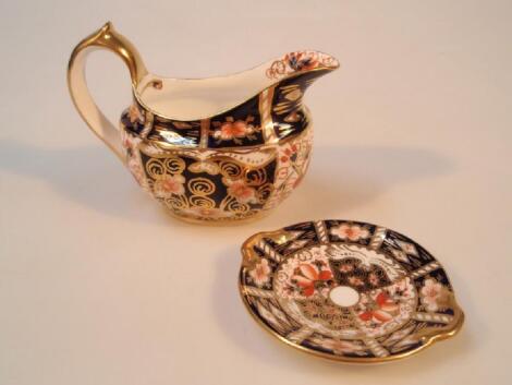 A Royal Crown Derby Imari 'witches' pattern milk jug and a small Royal Crown Derby dish