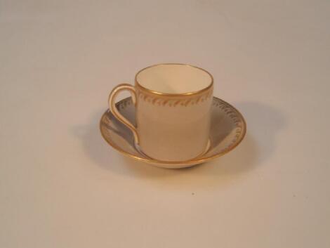 A KPM porcelain coffee can and saucer with broad banded grey decoration