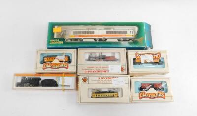 An Arnold N gauge steam locomotive and tender, 2262, boxed, Bachmann South Hills Line N gauge tram, Union Pacific Coaches, together with a Mehano OO gauge bendy tram, all boxed. (7)