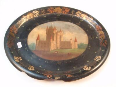 A Victorian papier mach? serving tray painted with a continental turret castle