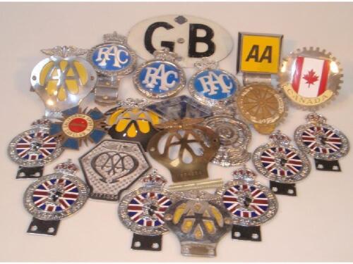 Assorted car badges including AA