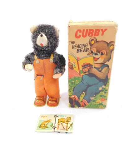 An Alps Japanese tin plate mechanical Cubby Bear, The Reading Bear, with integral key, boxed.