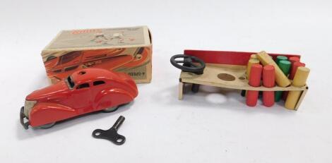 A Schuco tin plate clockwork Telestering Car 3000, with key and eleven pegs, one steering wheel. (boxed)