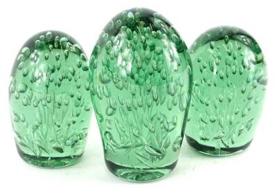 Three 19thC Nailsea glass dumps, each with bubble inclusions, the largest 16cm H.