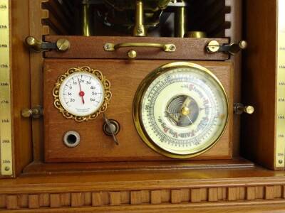 An unusual clock and weather station, housed in a cabinet previously containing the Millennium coin collection, the interior fitted with a clock, barometer and thermometer etc., 33cm W. - 3