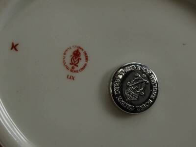 A Royal Crown Derby porcelain paperweight, modelled in the form of a seated swan, silver button to underside, 13cm L. - 2