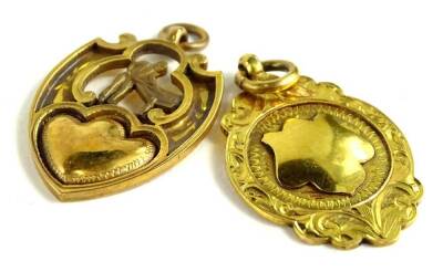 Two 9ct gold shield fobs, to include one of dull gold colour depicting a man playing snooker, and the other with scroll borders and central shield, inscribed Thomas Fattorini Ltd, Birmingham, 9.9g.