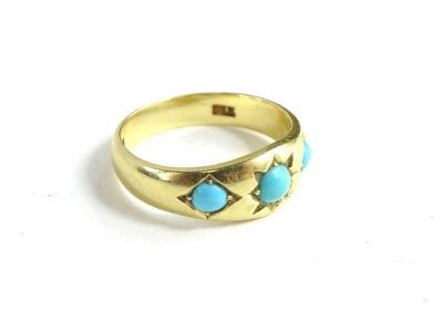 A Victorian 18ct gold turquoise ring, set with three turquoise stones, the central stone star set, ring size N½, 5.1g all in, in W.Marshall box.