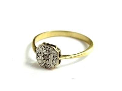 An Art Deco dress ring, with octagonal ring head, illusion set with tiny diamonds, in platinum, on a thin band, yellow metal, unmarked, ring size T, 2.2g all in.