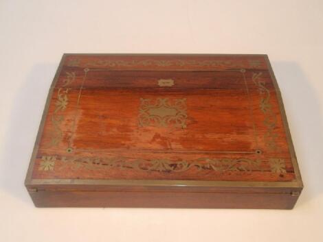 A Regency rosewood inlaid writing slope with brass borders and inlaid brass