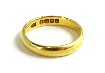 A 22ct gold wedding band, of plain design with maker's stamp S.P, ring size K, 3.9g all in.