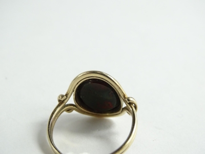 A green and red agate stone set dress ring, of oval design, with twist shaped borders, and two row band (AF-cut), yellow metal unmarked, 3.6g all in. - 2