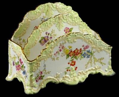 A Copeland porcelain letter rack, printed and painted with flowers, within cream and pale green borders, printed mark to underside, 22cm W.