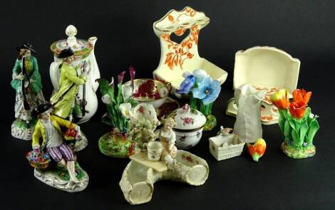 A collection of ceramics, to include a Dresden porcelain cup and cover painted with flowers, Royal Worcester leaf shaped jug, German porcelain figurines, pair of wall mounted toothbrush holders, etc.