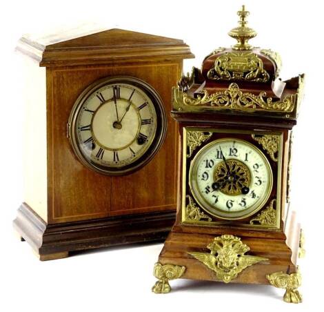 A continental mahogany case mantel clock, with gilt brass mounts, the enamel dial with Arabic numerals, possibly French, 35cm H, and an American mantel clock in an inlaid mahogany case.