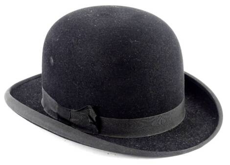 A bowler hat, with a label for A. Cheer and Sons of Boston, with super cushion fitting.