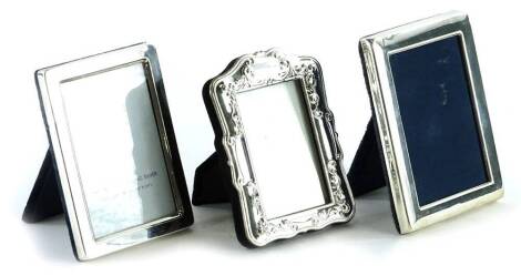 Two modern silver rectangular photograph frames, each with velvet backing and a silver plated example (3).