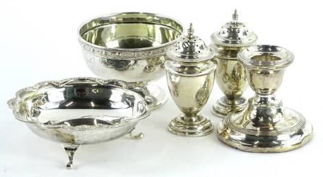 A collection of small silver, to include a pair of pepper pots, a dwarf candlestick, modern sugar bowl with Celtic band and a dish with a shaped edge, weighable silver 6½oz.