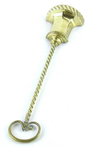 A brass door stop, of tapering form, with rope twist handle, 45cm H.