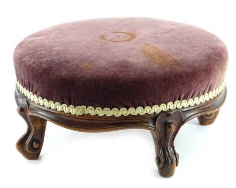 A Victorian mahogany circular foot stool, with a padded top, 21cm dia.