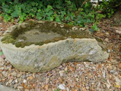 A carved stone bird bath, with spout to one end, 78cm L.