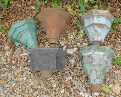 A collection of five cast iron rainwater hoppers, various designs.