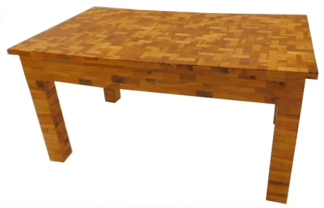 An unusual coffee table, of parquetry form, the rectangular top made from various specimen timbers, the top 61cm x 101cm.