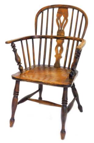 A 19thC ash and elm Windsor chair, with a pierced splat, solid seat, on turned tapering legs with H stretcher.