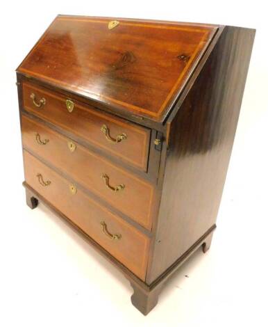 An Edwardian mahogany and satinwood crossbanded bureau, with three drawers on bracket feet, 80cm W.