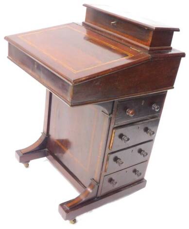 An Edwardian style mahogany and tulipwood cross banded Davenport, the top with a hinged lid enclosing a fitted interior, above a hinged sloping lid enclosing a fitted interior, above four drawers to the side on turned feet, 52cm W.