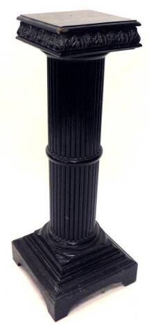 A late 19th/early 20thC ebonised plant stand, the square top carved with leaves etc., on a reeded column and stepped base, 99cm H.